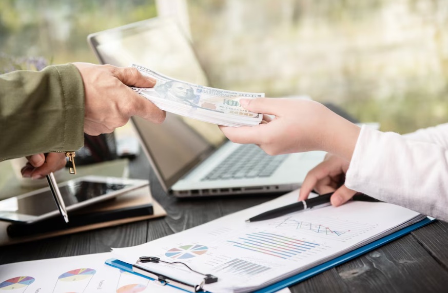business man giving money to his partner